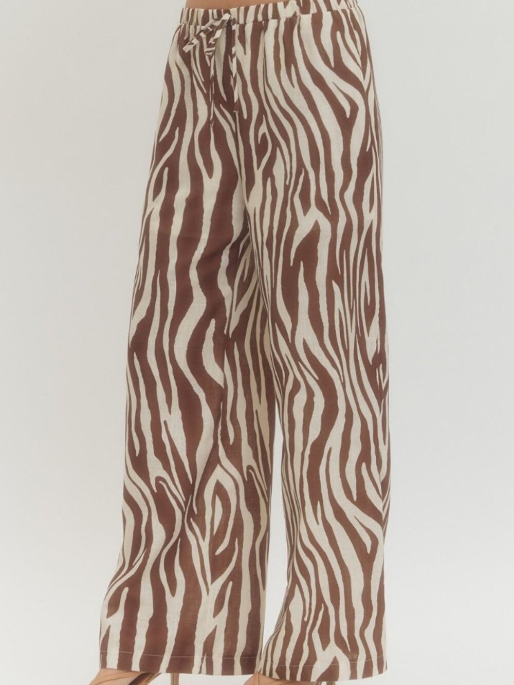 Zebra print wide-leg pants featuring elasticated waistband with drawstring tie